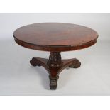 A 19th century rosewood and mahogany tilt top breakfast table, the round top with gadrooned top
