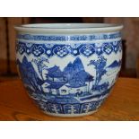 A Chinese porcelain blue and white jardiniere, Qing Dynasty, decorated with continuous scene of