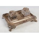 A late Victorian silver inkwell desk stand, maker Thomas Bradbury & Sons, London 1897, of rounded