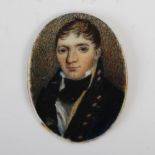 An early 19th century East India Company portrait miniature, a small oval portrait on ivory with