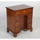 An early 20th century mahogany kneehole desk, in the early 18th century style, the moulded