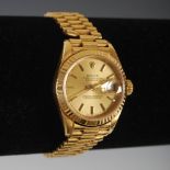 An 18ct gold ladies Rolex Oyster Perpetual Datejust wristwatch, the dial with baton numerals, with
