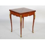 A 20th century French kingwood, rosewood and parquetry card table, the top with four folding