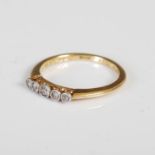 An early 20th century yellow gold and diamond five stone ring, the five graduated diamonds in
