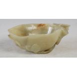 A Chinese pale celadon jade Lotus cup, shaped as a flowerhead and carved in relief with flowers,