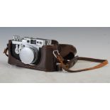 A Leica IIIg Rangefinder camera, circa 1956-60, Nr.980709, fitted with a Leitz Elmar f/2.8, 50mm