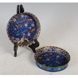 A pair of late 19th century Chinese cloisonne dishes, Qing Dynasty, each of round form with lilac