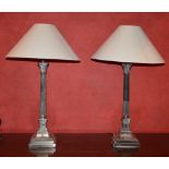 Pair of early 20th century electroplated Corinthian column table lamps, the stepped square plinths