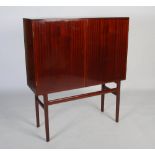 A mid-century Danish mahogany and teak cocktail cabinet / highboard, circa 1965-75, designed by