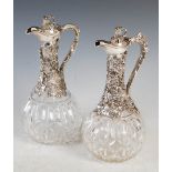 A pair of Victorian silver mounted claret jugs, maker Hirons, Plante & Co, Birmingham 1866 & 1870,