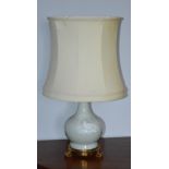 A gilt metal mounted Chinese porcelain celadon ground bottle vase converted to a table lamp and