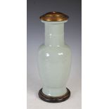 A 20th century Chinese celadon porcelain vase table lamp, of baluster form with carved scrolling