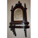 A fine early 19th century rosewood cased musical quarter chiming gothic style bracket clock and wall