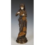 An early 20th century gilt, patinated bronze and carved ivory figure of 'La Liseuse' after a model