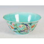 A Chinese porcelain turquoise ground footed bowl, bearing Qianlong seal mark but later, decorated