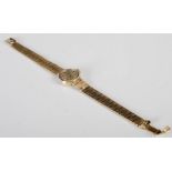 A 9ct gold Eterna ladies wristwatch, the circular champagne coloured dial with baton numerals, gross