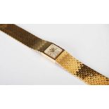 An 18ct gold ladies Rolex Precision bracelet watch, the square shaped silvered dial with baton