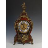 A French late 18th / early 19th century and later 'Boulle' style gilt bronze, cut brass and red