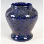 A rare Monart vase, shape C, with Paisley Shawl decoration of all over whorls on a dark blue ground,
