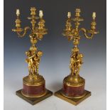 A pair of late 19th century French gilt bronze four light figural candelabra, the three acanthus