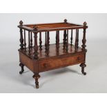 A 19th century walnut canterbury, the four turned supports with toupee finials and two dividers,