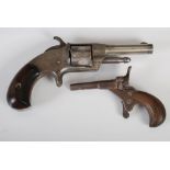 A late 19th century Smiths five shot rim fire calibre revolver, the top strap marked ' Smiths