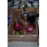 BOX OF ASSORTED GLASSWARE, VASES, DECANTERS, STOPPERS, OIL BURNING LAMP, ETC.