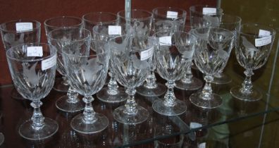 SET OF SEVENTEEN CLEAR GLASS WINE GOBLETS, EACH WITH WHEEL-CUT DECORATION DEPICTING VARIOUS BIRDS