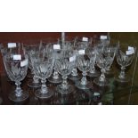 SET OF SEVENTEEN CLEAR GLASS WINE GOBLETS, EACH WITH WHEEL-CUT DECORATION DEPICTING VARIOUS BIRDS