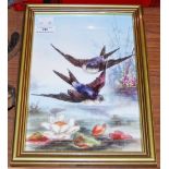 A FRAMED LATE 19TH / EARLY 20TH CENTURY HAND-PAINTED PORCELAIN PANEL DEPICTING TWO SWALLOWS.