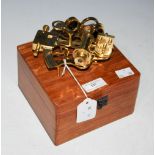 A KELVIN & HUGHES LONDON MINIATURE BRASS SEXTANT IN WOODEN BOX