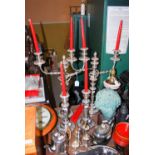 PAIR OF SHEFFIELD PLATE TWO-LIGHT CANDELABRA, AND A PAIR OF MATCHING SHEFFIELD PLATE CANDLESTICKS.