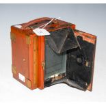 A LATE 19TH / EARLY 20TH CENTURY MAHOGANY AND LACQUERED BRASS BOX CAMERA, LABEL FOR 'A. H. BAIRD,