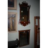 A GEORGE III STYLE FRETCUT WALL MIRROR TOGETHER WITH ANOTHER RECTANGULAR BEVELLED WALL MIRROR