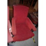 A 19TH CENTURY MAHOGANY ARMCHAIR WITH RED UPHOLSTERED BACK, ARMS AND SEAT.