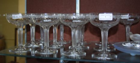 SET OF THIRTEEN EARLY 20TH CENTURY CHAMPAGNE COUPES WITH ETCHED SCROLL AND STAR DETAIL ON FACETED