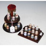 GRADUATED THREE-TIER PIN CUSHION SET WITH COLLECTION OF ASSORTED ROYAL CROWN DERBY CERAMIC THIMBLES,