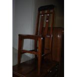 EARLY 20TH CENTURY VIENNA SECESSION OAK AND LEATHER UPHOLSTERED SIDE CHAIR WITH PIERCED VERTICAL