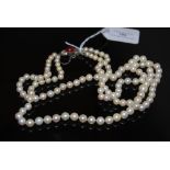 MID-20TH CENTURY CULTURED PEARL NECKLET WITH WHITE METAL, DIAMOND AND SYNTHETIC RUBY SET CLASP,