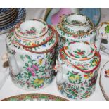 THREE ASSORTED CHINESE FAMILLE ROSE TEA KETTLES AND COVERS.