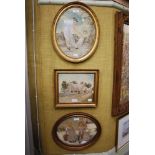 A GROUP OF THREE EARLY 20TH CENTURY FRAMED EMBRIODERED SILK PANELS, INCLUDING AN OVAL SCENE OF A