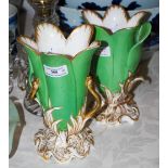 A PAIR OF 19TH CENTURY APPLE GREEN GROUND PORCELAIN VASES WITH GILDED SERPENT AND FOLIATE DETAIL