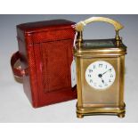 BRASS CARRIAGE CLOCK WITH ARABIC NUMERAL DIAL AND ORIGINAL CASE.