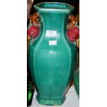 A DECORATIVE CHINESE GREEN GLAZED HEXAGONAL SHAPED VASE, WITH TWIG AND POMEGRANATE HANDLES