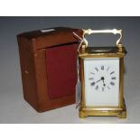 BRASS CARRIAGE CLOCK WITH ROMAN NUMERAL DIAL AND ORIGINAL CASE.