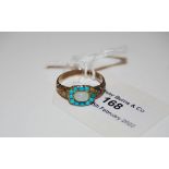 A 9CT GOLD OPAL AND TURQUOISE RING.