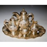 A 20TH CENTURY WHITE METAL MIDDLE-EASTERN FIVE-PIECE COFFEE SET, COMPRISING TWO GRADUATED COFFEE