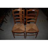 PAIR OF OAK ARTS AND CRAFTS LEATHER-BACK SIDE CHAIRS WITH WOVEN RISH SEATS, TOGETHER WITH AN EARLY