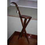 EARLY 20TH CENTURY STAINED BEECH WALKING CANE/ COMBINATION STOOL WITH CIRCULAR CANE-WORK SEAT,