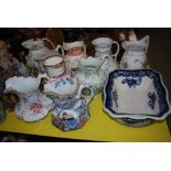 NINE ASSORTED VICTORIAN AND LATER WASH EWERS, AND TWO POTTERY WASH BASINS.